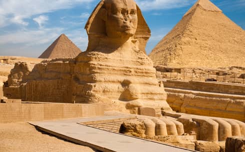 The Great Sphinx including the pyramids in the background