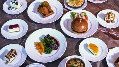 Table filled with a variety of brunch items served on white dishes