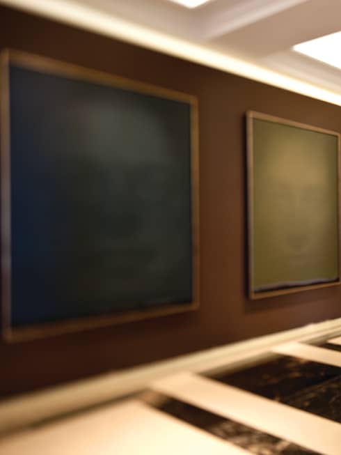 A man and woman walking through an art gallery.