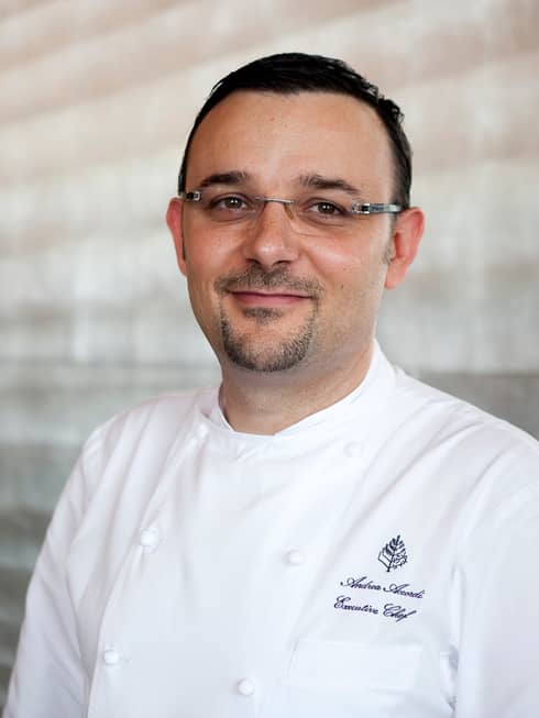 Portrait photo of Executive Chef Andrea Accordi in white uniform