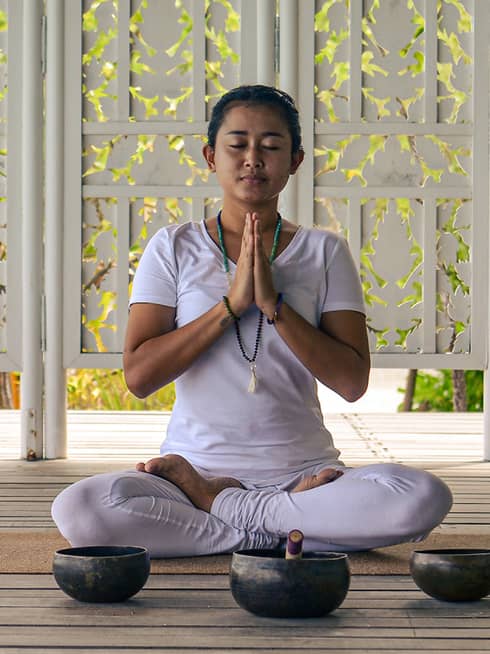 Our resident yogi, Sri Yuliastini, leading a couple?s open-air meditation