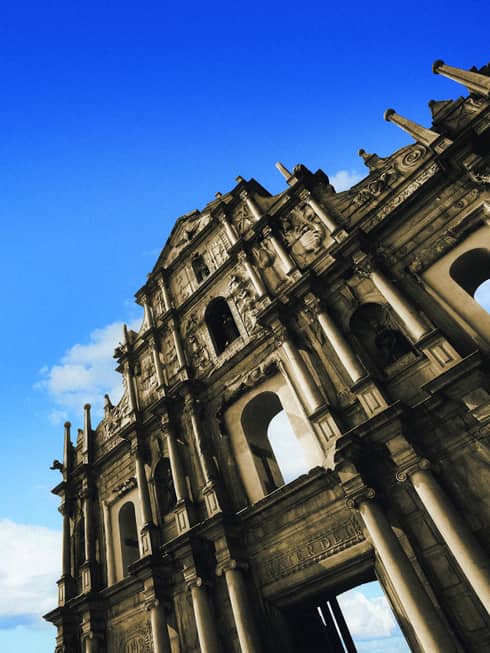 Looking up at St. Paul cathedral ruins, facade against blue sky