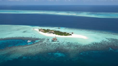 Voavah private island in the bright blue ocean
