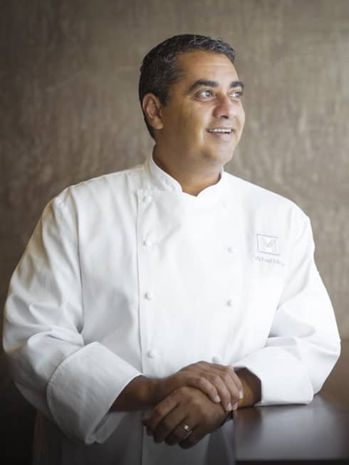 A portrait of Chef Michael Mina smiling