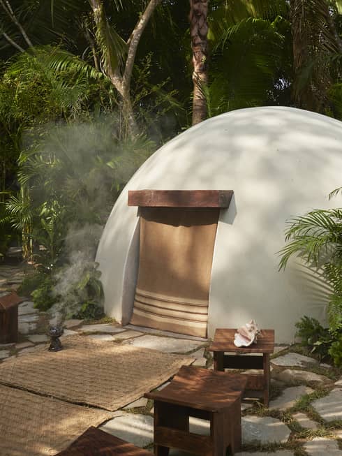 Traditional temazcal "house of heat" in jungle-like setting