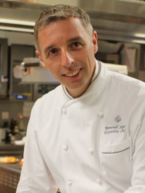 Portrait photo of Executive Chef Romuald Feger in uniform