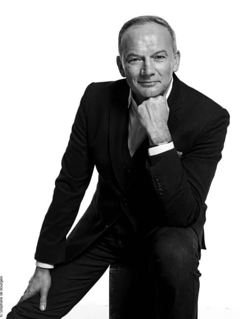 Black-and-white portrait photo of Executive Chef Christian Le Squer