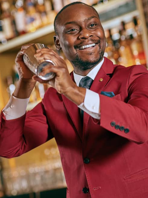 Keith Motsi shaking a cocktail