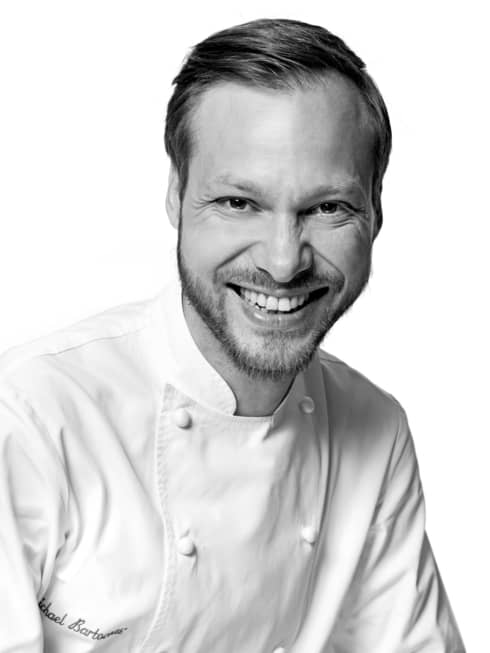 Black and white portrait photo of Chef Michaël Bartocetti in uniform