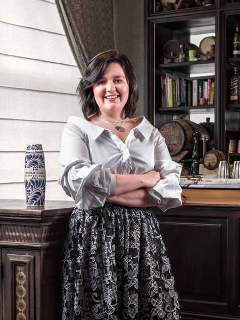 Portrait photo of Fifty Mills bartender Fatima Léon by bookshelf