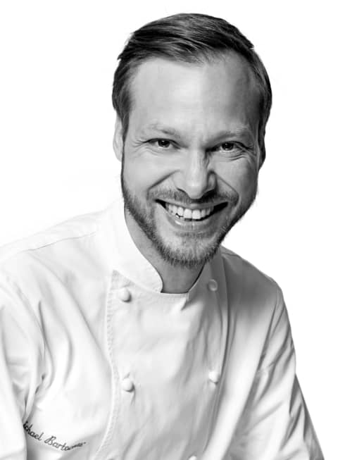 Black and white portrait photo of Chef Michaël Bartocetti in uniform