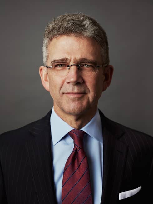Portrait photo of Four Seasons Hotel President and Chief Executive Officer J. Allen Smith wearing suit, tie