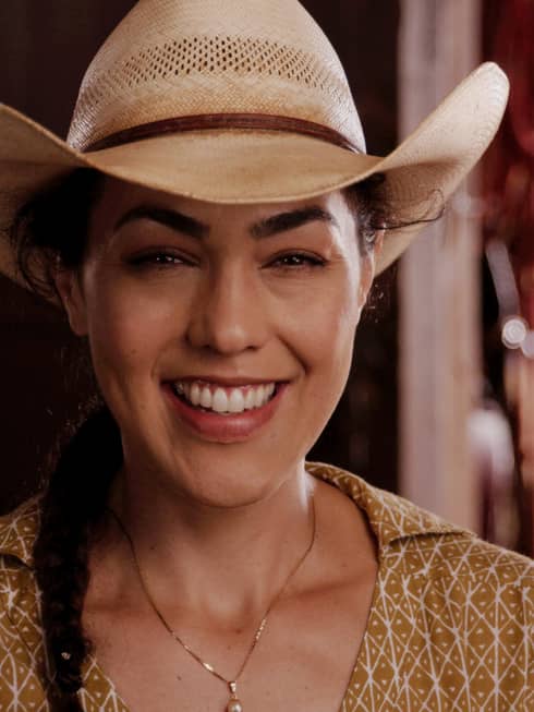 Lanai staff member wears a cowboy hat at a cattle ranch