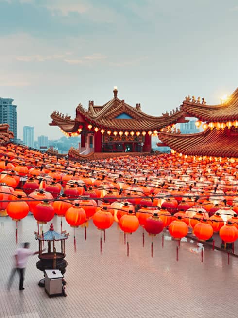 Chinese temple decorated with rows of hanging red paper lanterns