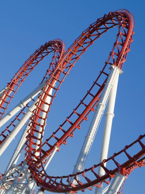 A white and red rollercoaster with two loops.