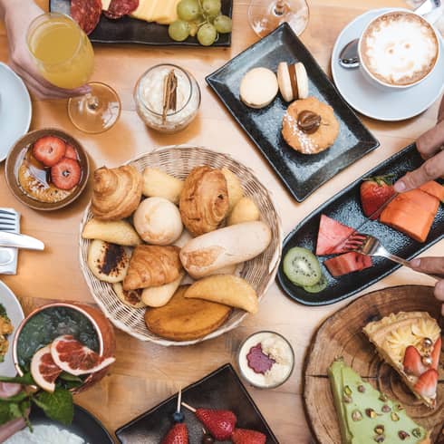 An assortment of pastries and desserts on a table.