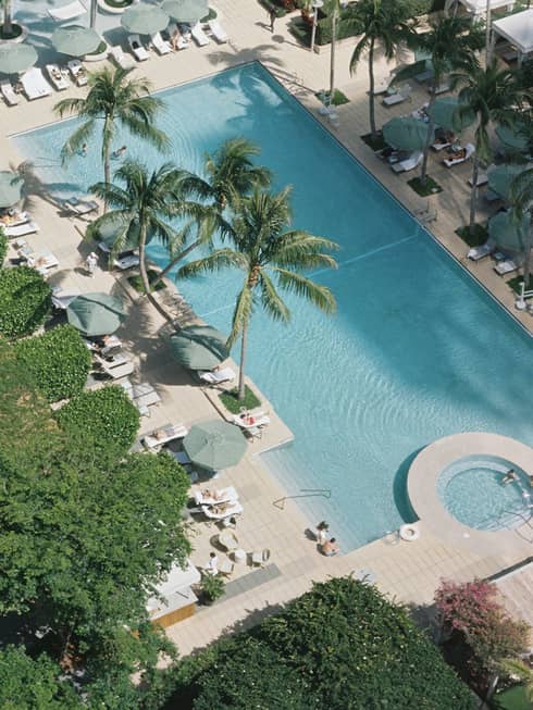 Aerial view of pool, trees and sun loungers at Four Seasons Hotel Miami