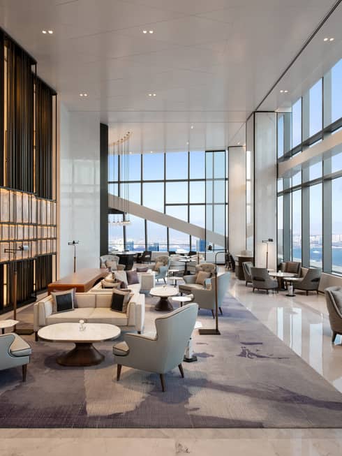 Hotel lounge with water view at Four Seasons Hotel Dalian