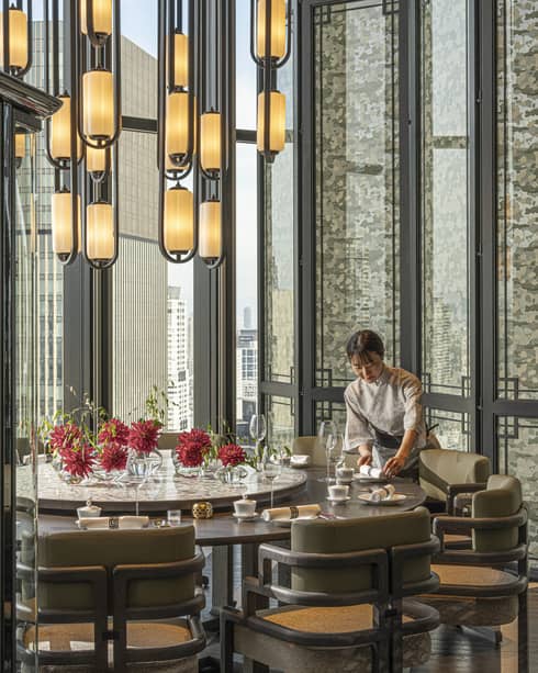Light-filled dining area inside Jiang Nan Chun restaurant at Four Seasons Hotel Osaka
