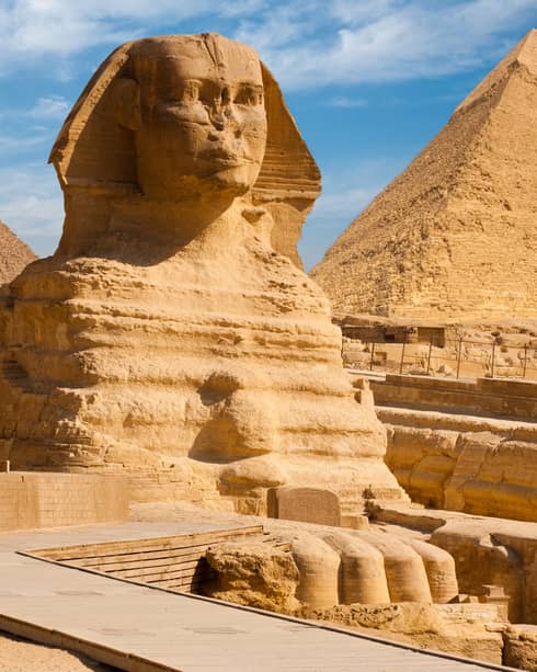 The Great Sphinx including the pyramids in the background