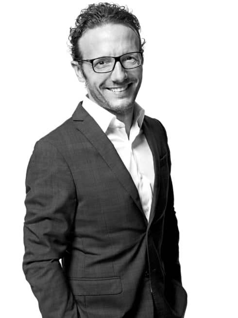Black-and-white portrait photo of Chef Simone Zanoni