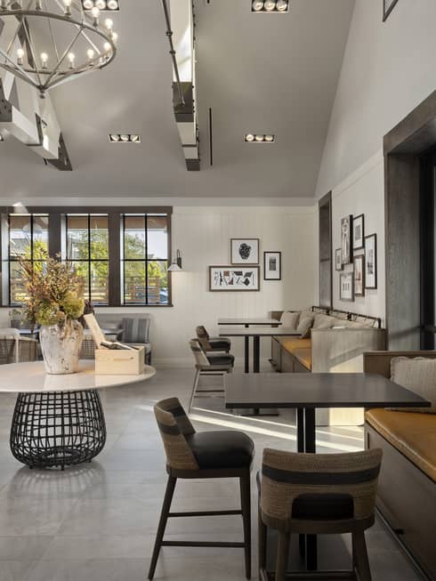A large room with many seats and an eclectic style.