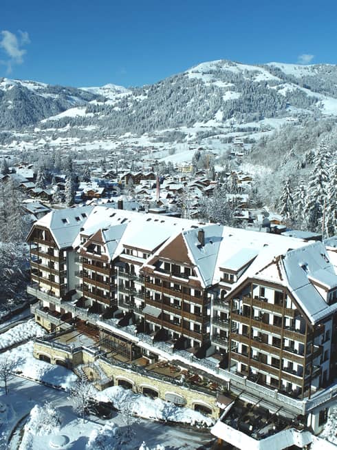 Aerial rendering of resort with mountains in background