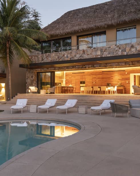 Private residence, Casa Vista, at Four Seasons Resort Tamarindo, illuminated pool deck at night