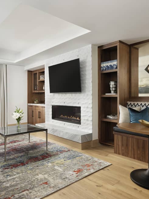 Garden suite with modern seating area, wood bench with cushions and table