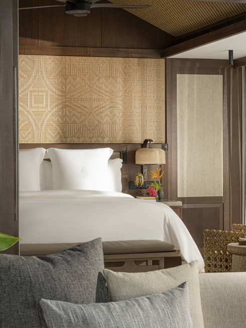 A one-bedroom suite opening to a bedroom with king bed