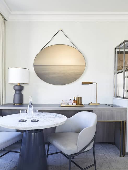 Round marble table with two chairs