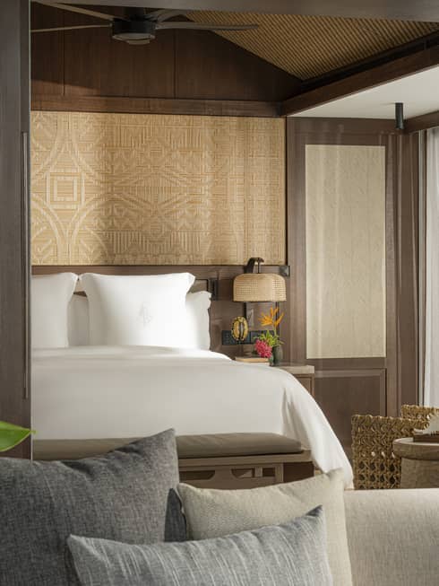 A one-bedroom suite opening to a bedroom with king bed