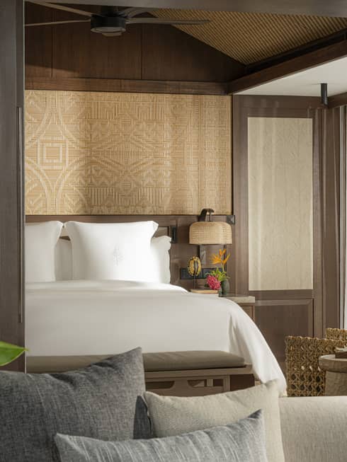 A one-bedroom suite opening to a bedroom with king bed