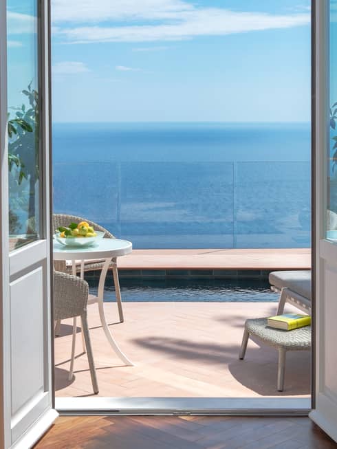 Door leading to private terrace with plunge pool overlooking the sea