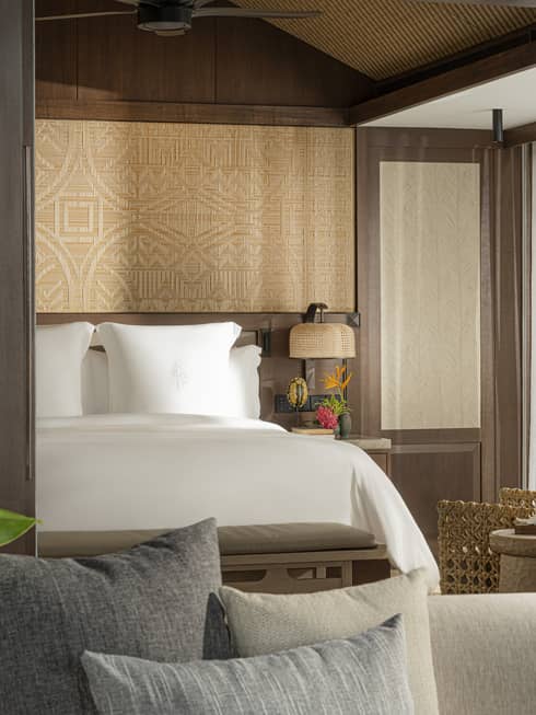 A one-bedroom suite opening to a bedroom with king bed