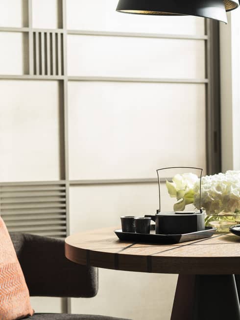 Small table and chair with lamp, flower