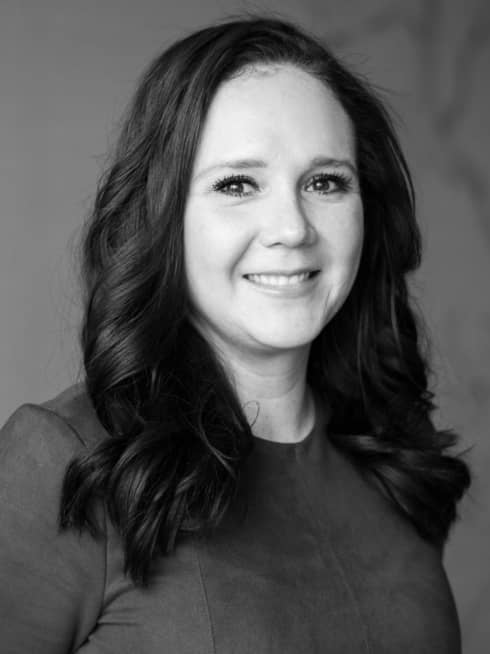 A headshot of Danae Angul in black and white.