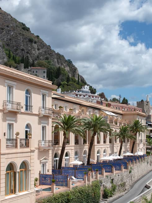 The Mediterranean facade of the palace situated next to the scenic landscape