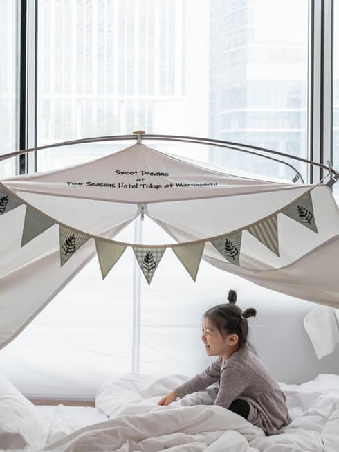 Little girl in kids glamping tent