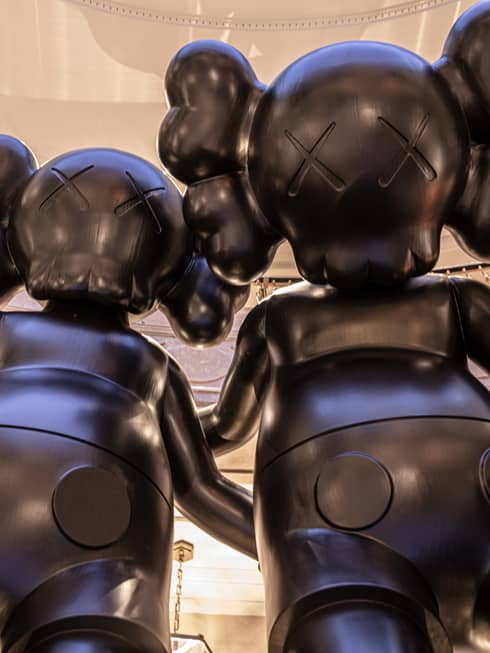 Two oversized figure sculptures in hotel lobby