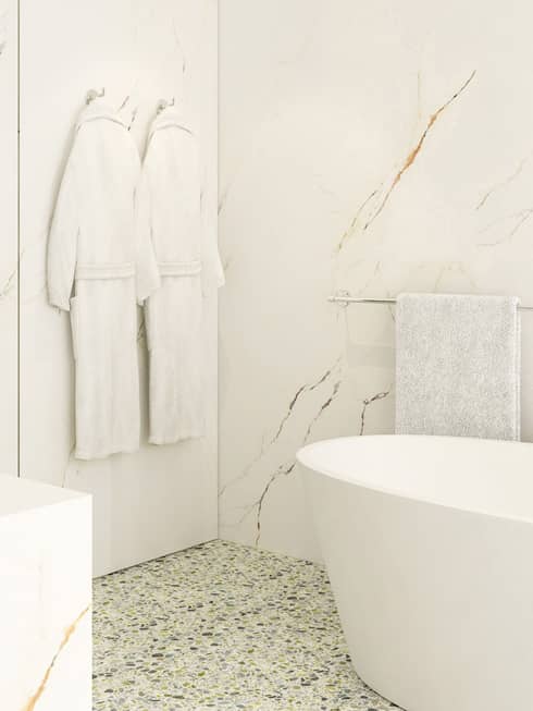 Minimalist bathroom with a freestanding tub, marble walls, and glass shower. Two white bathrobes hang near folded towels, creating a serene, clean atmosphere.