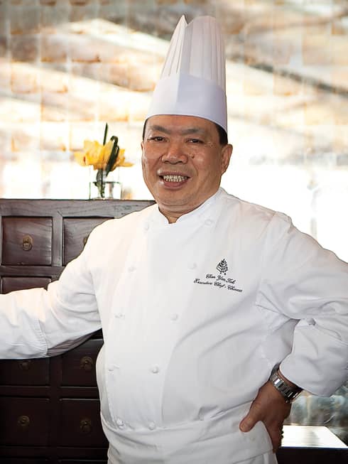 Portrait photo of Executive Chinese Chef Chan Yan Tak in white uniform