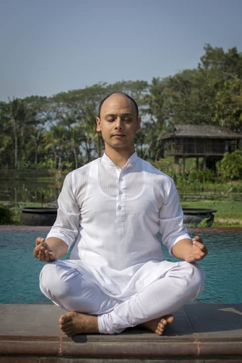 Master Yogi Dheeraj Singh Patel in a yoga pose