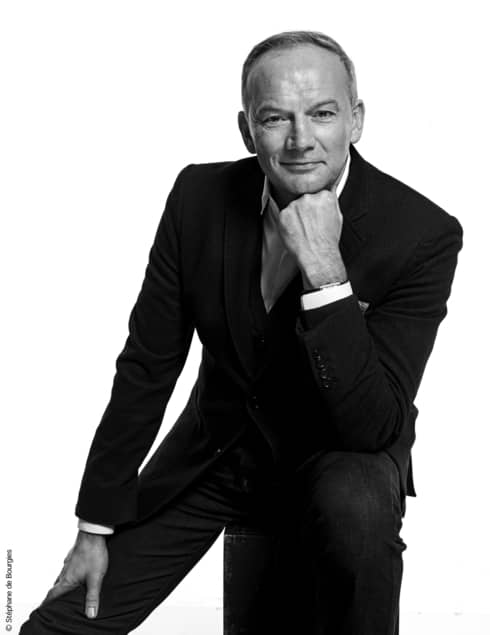 Black-and-white portrait photo of Executive Chef Christian Le Squer