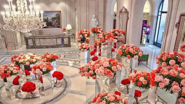 Beautiful pink and red flowers in large vases in luxury event space