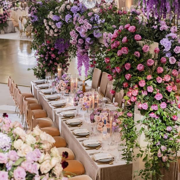 Wedding table setting with elaborate floral arrangements