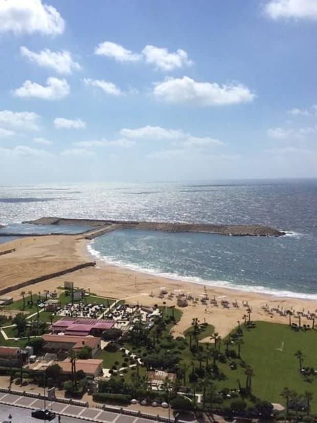 Alexandria Egypt Hotel Luxury Four Seasons At San Stefano Looking Down Over Green Lawn Golden Sand Beach And Mediterranean Sea In Front Of