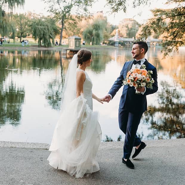 Couple celebrating their wedding in a luxury hotel venue by the lake.