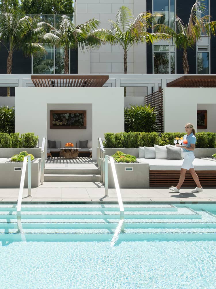 Swimming pool and deck area, with pool attendant