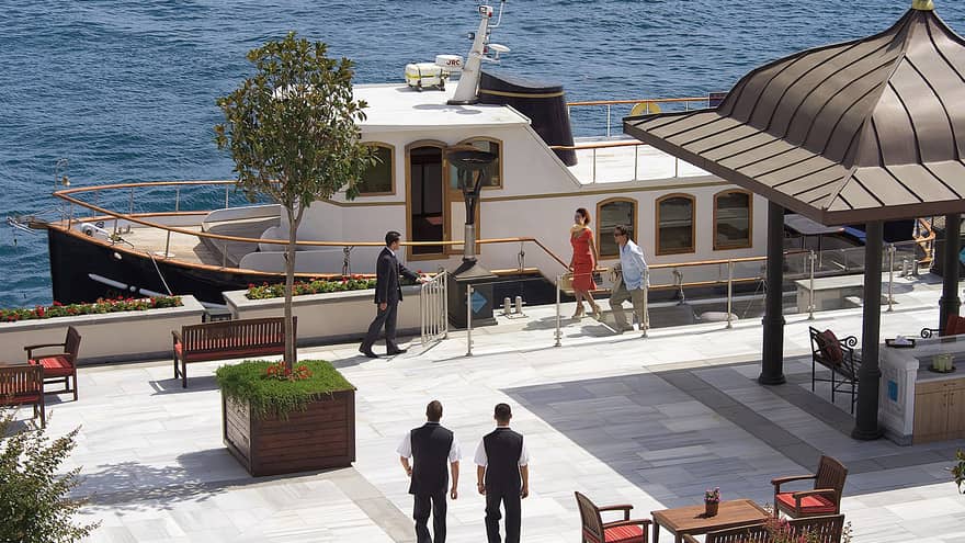 Looking down at people on dock by private cruise yacht 